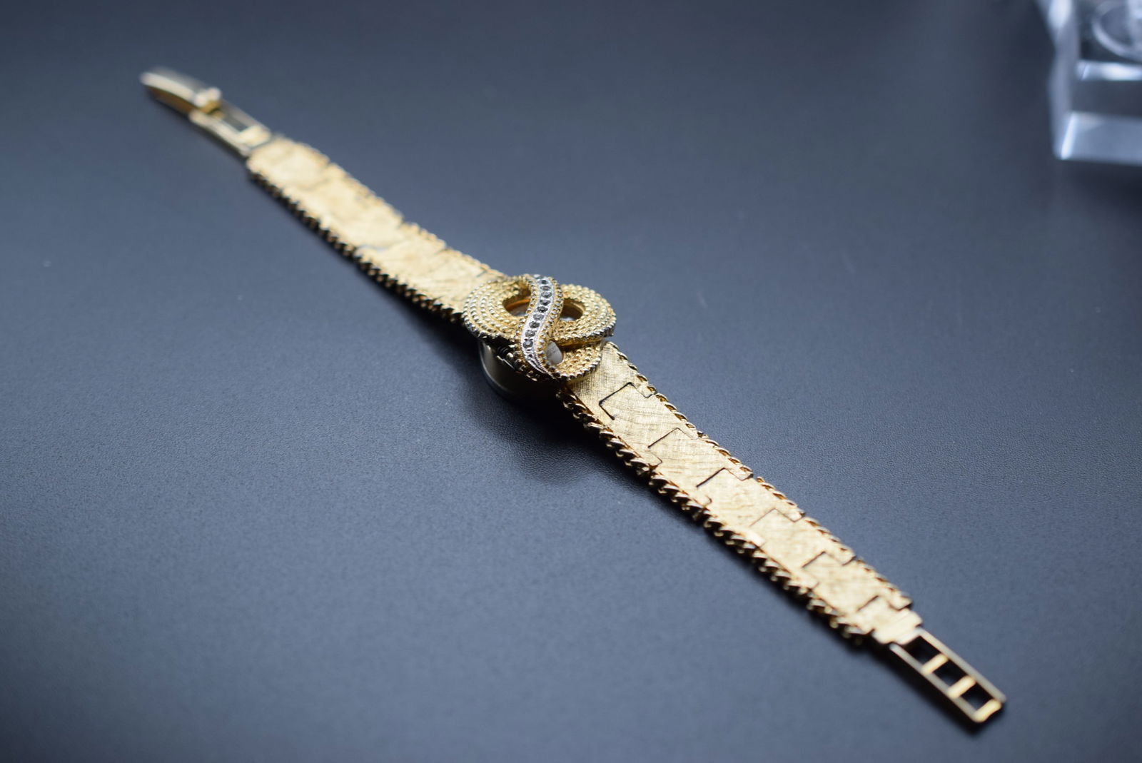 Taylor Shock Proof Antimagnetic Watch Swiss Vintage 1950's Lot 975: Taylor Shock Proof Antimagnetic Watch Swiss Vintage 1950's Hidden by Bracelet Peek to See time not overwound but not keeping time or working measures 7" long x 7/8" signed Taylor Antimagnetic Shockpro