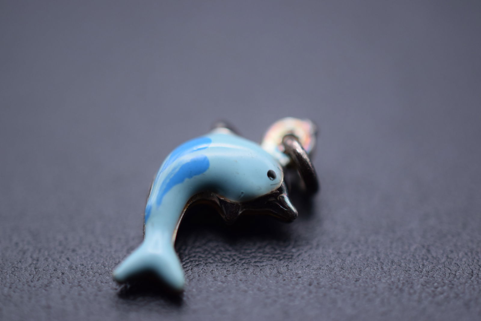 Teeny Tiny Enamel Dolphin Charm Pendant Lot 1126: Teeny Tiny Enamel Dolphin Charm Pendant measures 1/2" x 1/4"