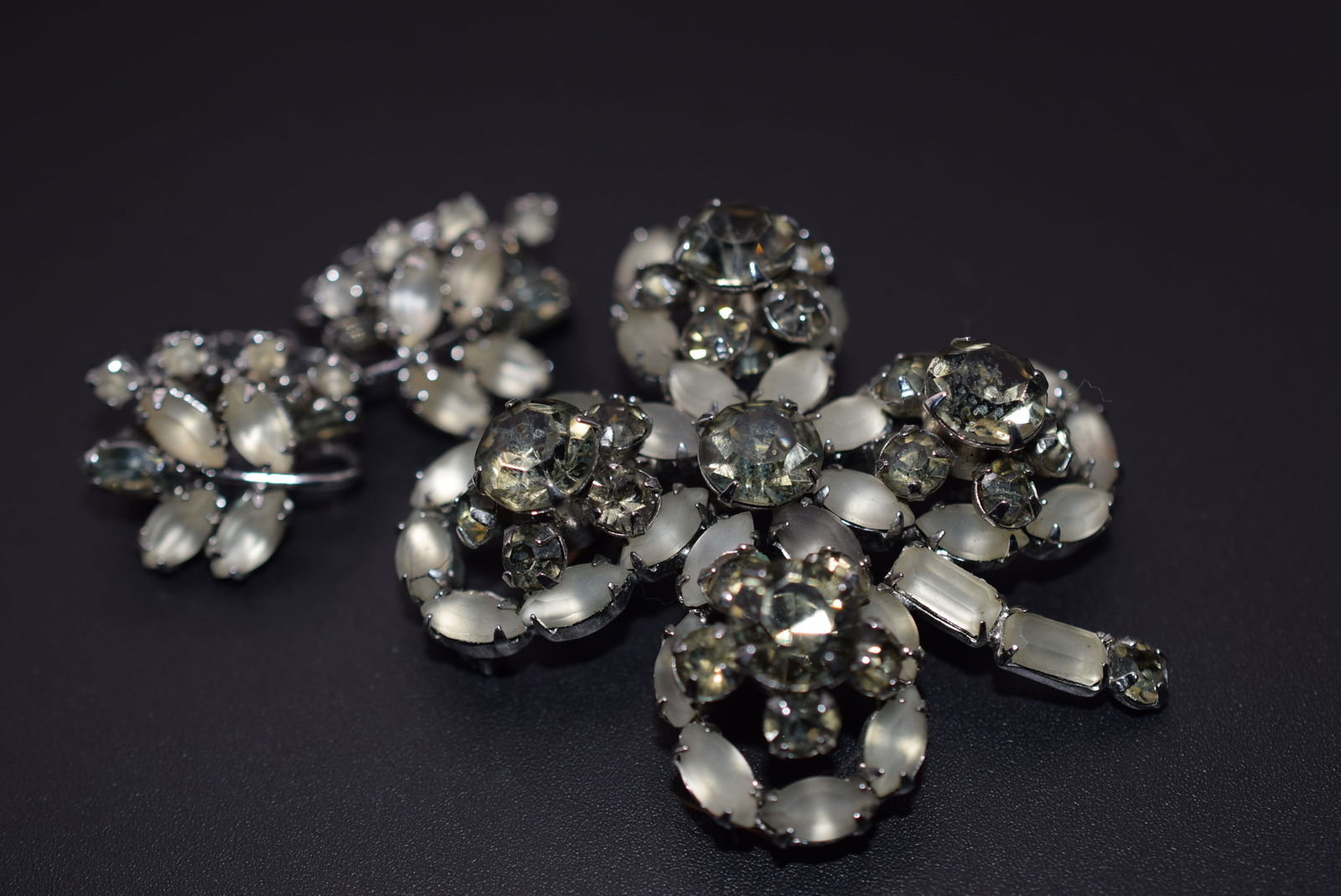 Frosted Givre Rhinestone Brooch & Clip Earrings Vintage 1950'sLot 1174: Frosted Givre Rhinestone Brooch & Clip Earrings Vintage 1950's Earrings measures 7/8" x 3/4" Brooch Measures 2" x 1 3/4"