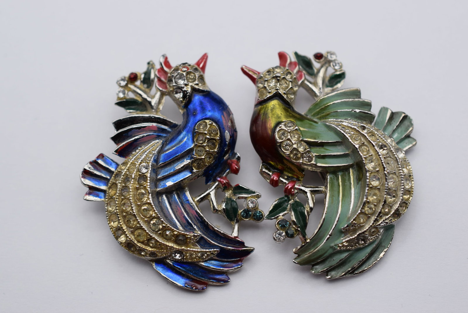 Pair Duette Clips Bird Enamel 1940's Bird Paradise Lot EH 14: Duette Clips Bird Enamel 1940's Bird Paradise measures 2" x 1 1/2" each bird the blue bird has wear to the chest and the duette part of the brooch is missing