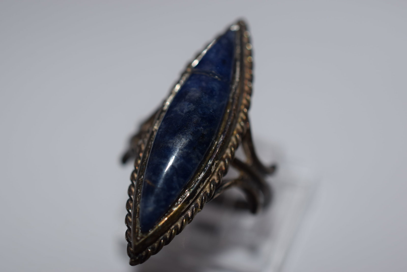 Sodolite Huge Finger Ring Sterling 925 Vintage Size 6 Lot EH 139: Sodolite Huge Finger Ring Sterling 925 Vintage Size 6 top measures 1 1/4" long has a crack in the stone at one end, signed inside Ster and weighs 5.87 grams