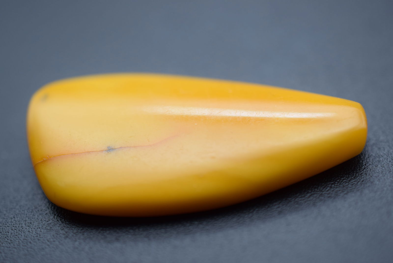 Egg Yolk Baltic Old Amber Genuine Lot# BE 341: Egg Yolk Baltic Old Amber Genuine weighs 1.95 grams measures 1 1/2" x 3/4"