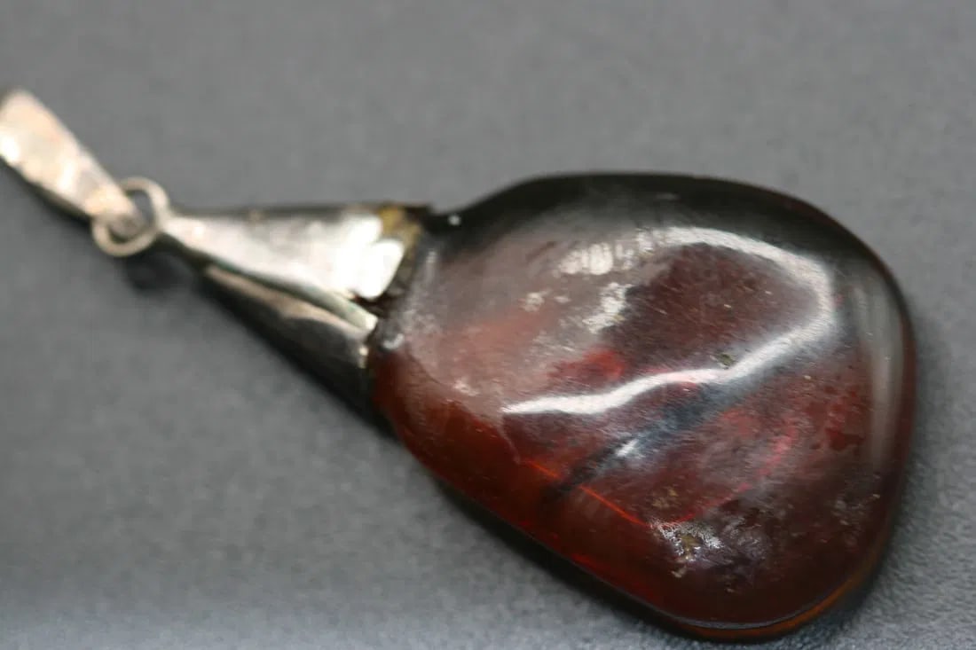 Genuine Baltic vintage Amber Pendant Sterling Silver 925 .Lot#361: Pendant Genuine Baltic vintage Amber Sterling Silver 925 measures 2 1/8" with the bale hook and is 1" wide nice smooth amber very old cognac color piece stamped 925