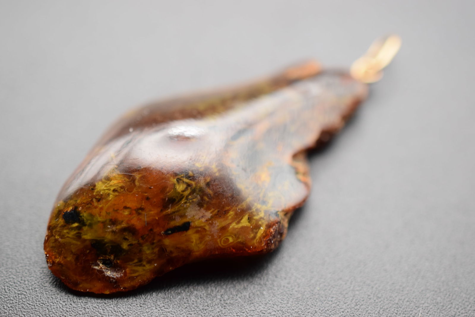 Genuine Amber Pendant Lot EH 481: Genuine Amber Pendant measures 2" x 1 1/8" weighs 4.08 grams