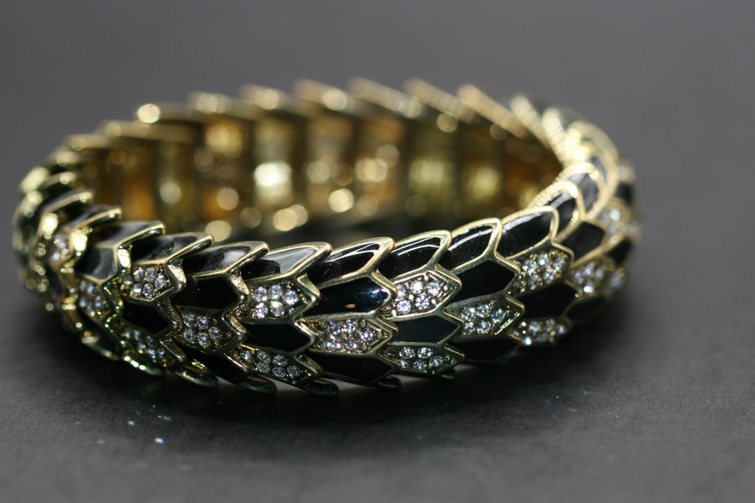 Joan Rivers Enamel Rhinestone Superb Bracelet Lot 531: Joan Rivers Enamel Rhinestone Superb Bracelet stretches but is 2 1/4" before stretch and is 3/4" wide Simply elegant and stunning !
