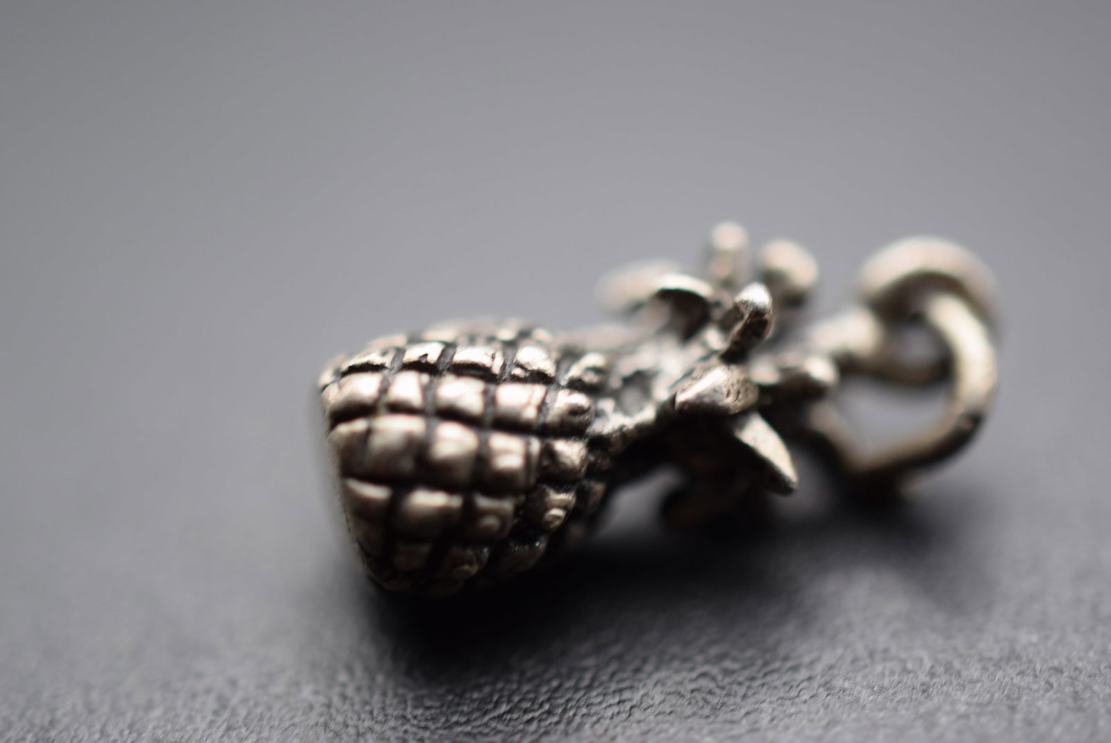 Pineapple Sterling Silver 925 Charm Pendant Lot EH 550: Pineapple Sterling Silver 925 Charm Pendant measures 5/8" x 1/4" signed STG on bale weighs 2.1 grams