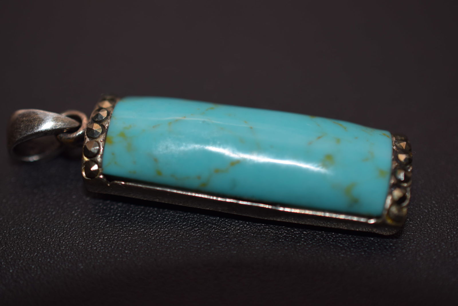 Turquoise Sterling Marcasite Pendant Lot EH 775: Turquoise Sterling Marcasite Pendant measures 1 1/4" x 1/2" plus the bale weighs 4.7 grams