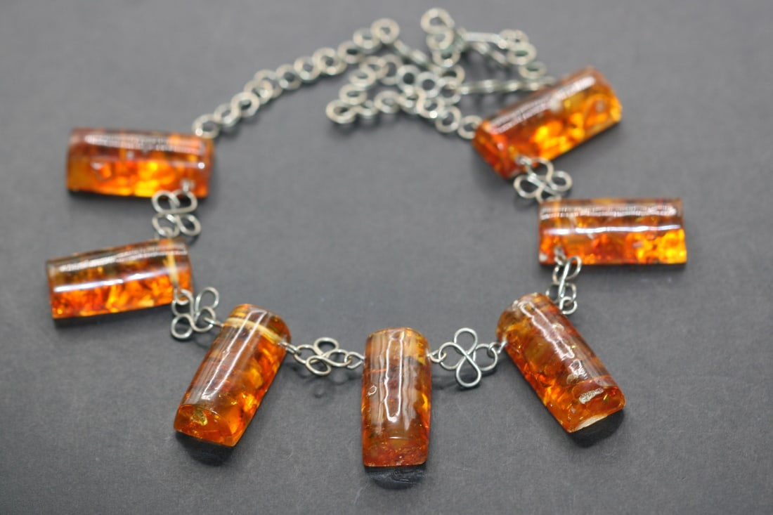 Amber Genuine Necklace Vintage Lot 807: Amber Genuine Necklace Vintage measures 16" long and the amber pieces are1 1.8" x 5/8" each and they weigh whithout the chain 22 grams just the amber
