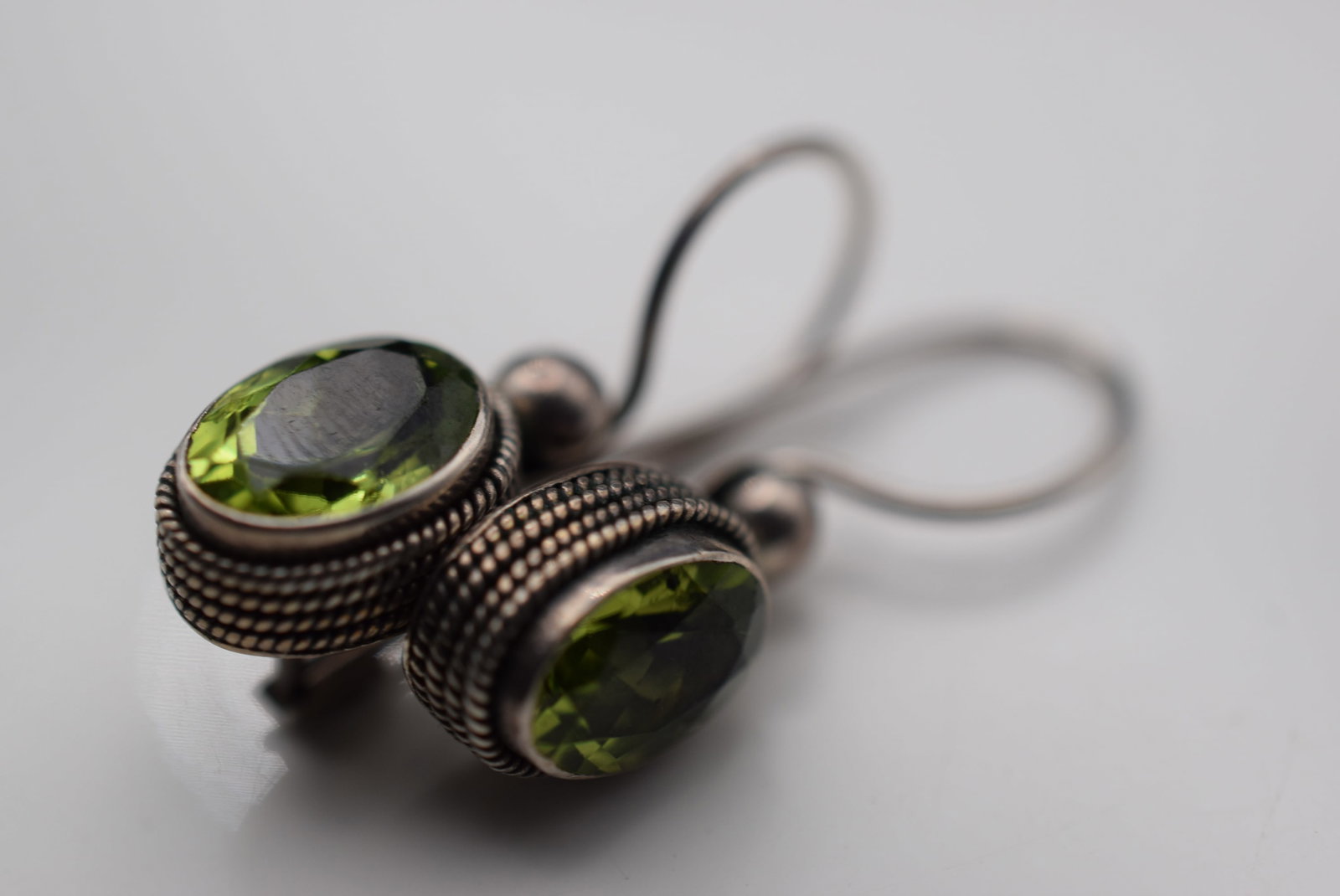 Peridot CZ Pierced Sterling Silver 925 Earrings Lot EH 839: Peridot CZ Pierced Sterling Silver 925 Earrings measures 1/2" x 3/8" plus the bale signed 925 on the earrings weighs 3.15 grams