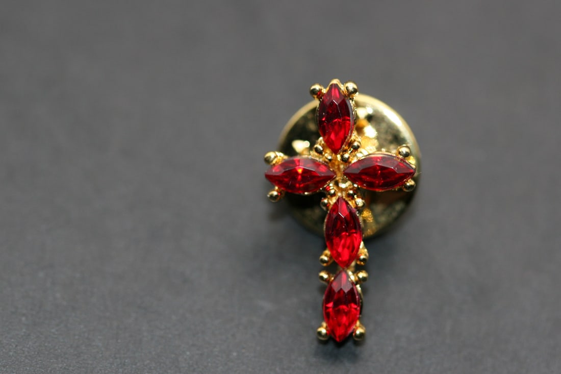 Birthstone Rhinestone Cross Pin Brooch January Garnet Lot 1052: Birthstone Rhinestone Cross Pin Brooch measures 7/8" x 1/2" January Garnet