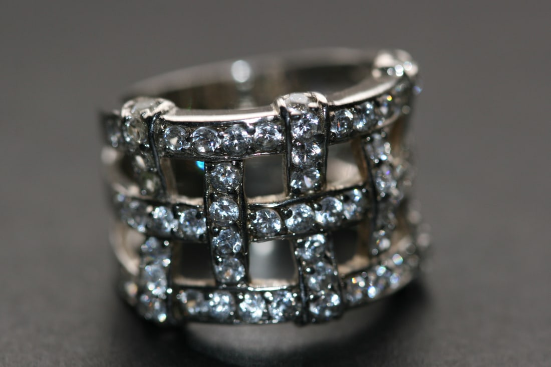 Lattice Rhinestone Band Ring Super Wide Sterling Size 8 925 Lot 1206: Lattice Rhinestone Band Ring Super Wide Sterling Silver 925 weighs 8.7 grams Size 8 top measures 5/8" wide