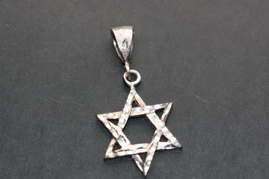 Star of David Pendant Sterling Silver 925 Lot 1234: Star of David Pendant Sterling Silver 925 weighs 4.16 grams measures 1" in diameter plus bale stamped 925 on the bale