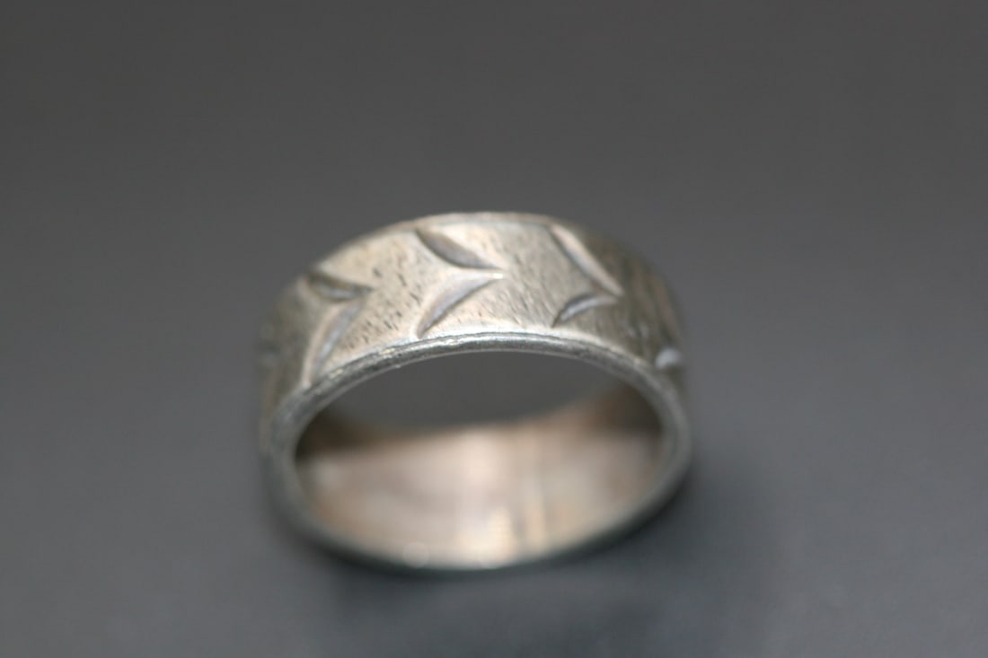 Sterling Band Ring Silver 925 vintage size 7.25 signed .Lot#103: Sterling Band Ring Silver 925 vintage size 7.25 signed with a makers mark of and eye with a chevron through it. also marked Sterling on the inside. Nice patina