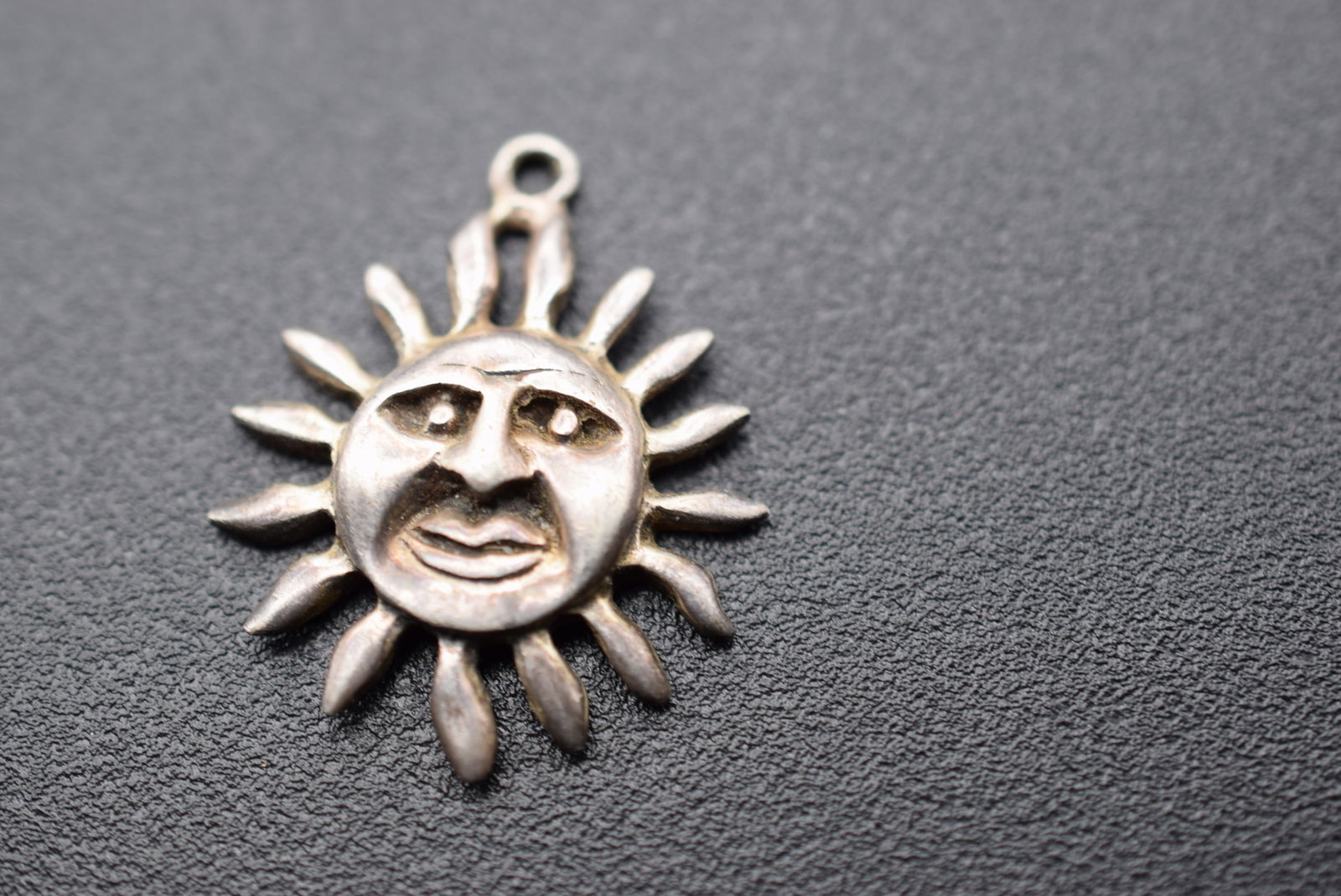 Repousse Sun Pendant Sterling Silver 925 SMA Lot 1059: Repousse Sun Pendant Sterling Silver 925 Signed 925 SMA measures 1" x 7/8" weighs 3.20 grams