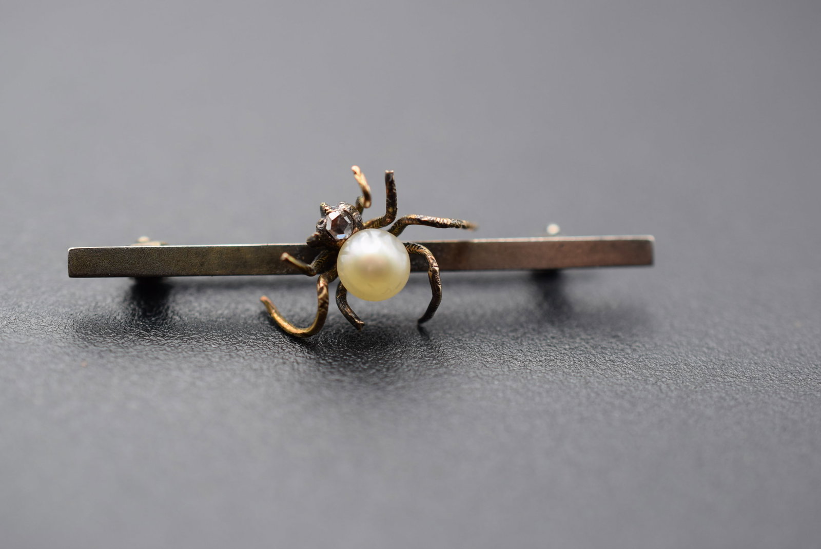 Spider Bar Pin Vintage 1920's Lot 1152: Spider Bar Pin Vintage 1920's measures 1 5/8" x 1/2" has a nick on the side of the pearl, the clasp is old style closure indicative of its age