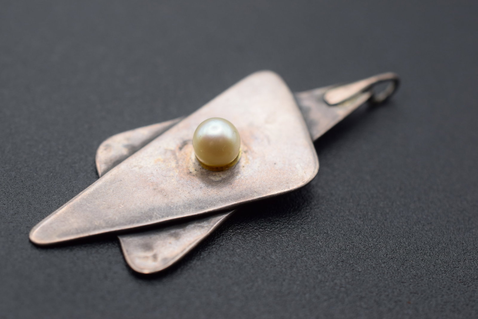 Hammered Handmade Silver Cultured Pearl Modernist Pendant Lot 1159: Hammered Handmade Silver Cultured Pearl Modernist Pendant measures 2 1/2" x 1" unmarked weighs 11 grams
