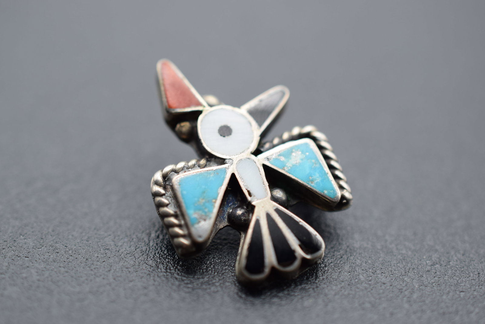 Inlaid Turquoise Onyx MOP Bird Brooch Pin Lot 1163: Inlaid Turquoise Onyx MOP Bird Brooch Pin measures 1" x 3/4"