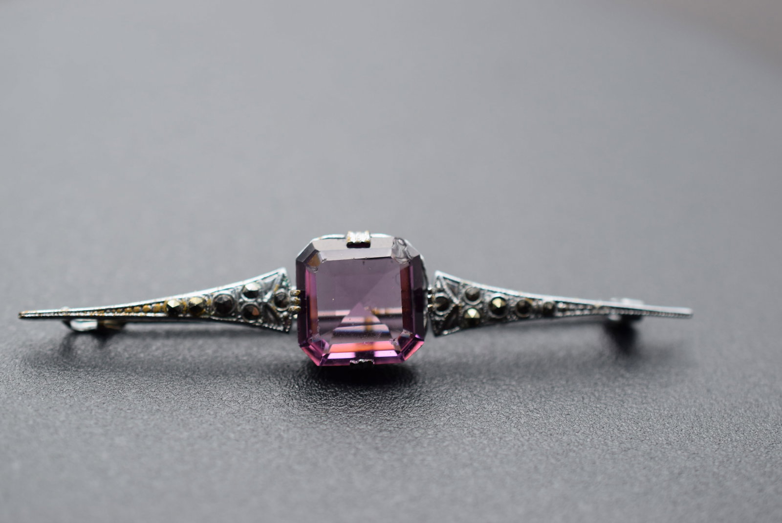 Amethyst Rhinestone Marcasite Brooch Pin Vintage 1950's Lot 1171: Amethyst Rhinestone Marcasite Brooch Pin Vintage 1950's measures 2 1/2" x 1/2" wear to the plating on the sides and back see photos
