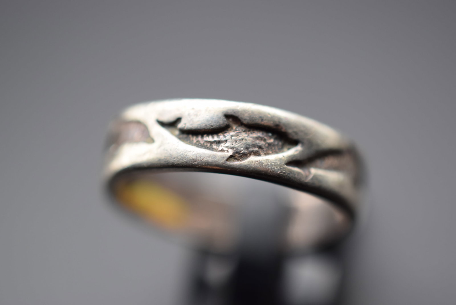 Dolphin Dancing Band Sterling Silver 925 Ring Size 7.5 Lot 286: Dolphin Dancing Band Sterling Silver 925 Ring Size 7.5 Weighs 4.6 grams Top measures 1/4" signed 925 makers mark C and 3 squiggle lines like octopus