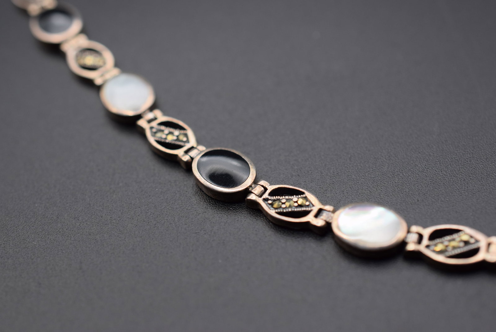 Sterling Marcasite Mother Of Pearl Onyx Bracelet 925 Lot GJ 425: Sterling Marcasite Mother Of Pearl Onyx Bracelet 925 measures 7" long signed 925 weighs 12.2 grams