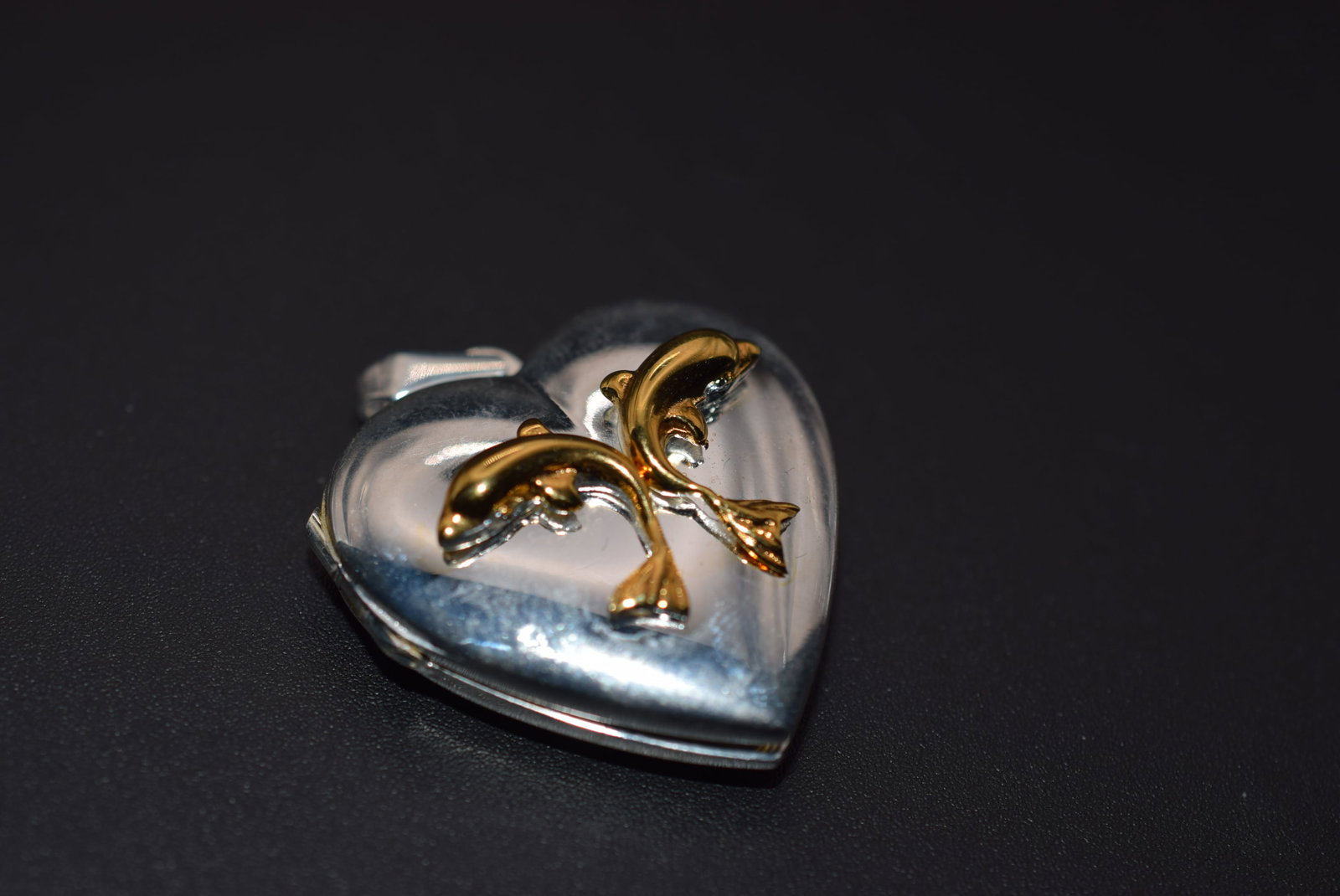 Dolphin Heart Locket Pendant Sterling Silver 925 Lot 1173: Dolphin Heart Locket Pendant Sterling Silver 925 weighs 12.54 grams measures 1 1/4" x 1 1/4" without the bale has both inserts signed on the bale TOB for makers mark and 925
