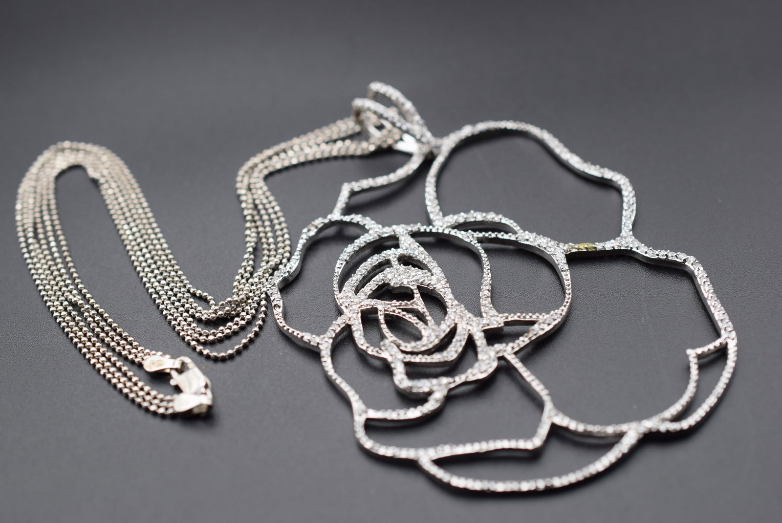 Sterling Silver 925 23 grams Vintage Necklace 19" long signed 925 Lot HK 59: Sterling Silver 925 23 grams Vintage Necklace 19" long signed 925 on the pendant and on the chain pendant measures 4" x 3" chain is triple strand faceted bead Sterling chain measures 18" long