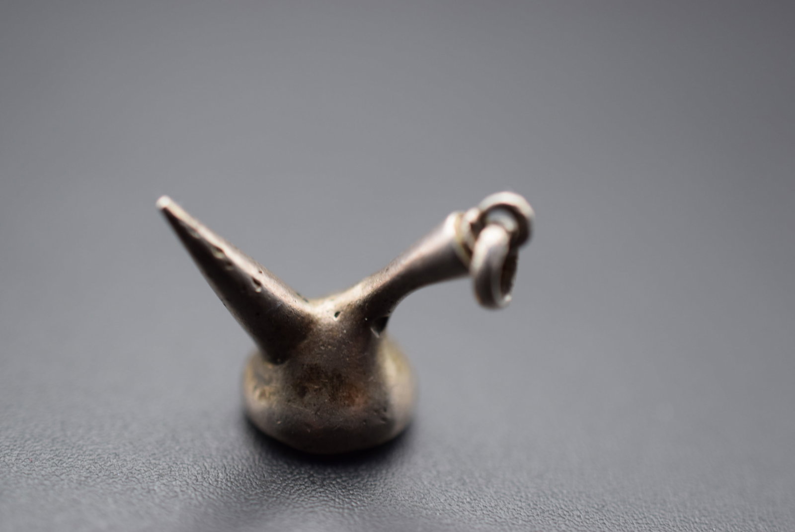 Wine Pourrer Sterling Charm Pendant Vintage Lot EH 275: Wine Pourrer Sterling Charm Pendant Vintage measures 7/8" x 3/4" unsigned weighs 5 grams