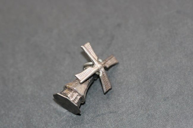 Dutch Holland Windmill Silver 835 Charm Pendant moveable .Lot#444: Dutch Holland Windmill Silver 835 Charm Pendant moveable measures 3/4" x 1/2" and the windmill turns signed on the bottom 835 with some other makers hallmarks