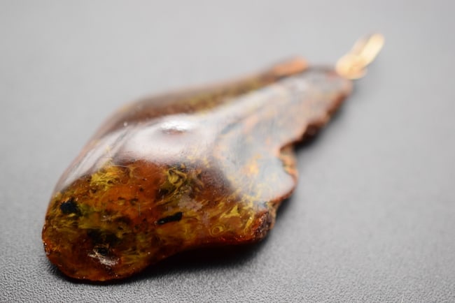 Genuine Amber Pendant Lot EH 481: Genuine Amber Pendant measures 2" x 1 1/8" weighs 4.08 grams