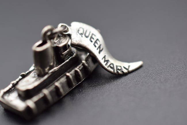 Queen Mary Tug Boat Pendant Charm Sterling Silver 925 Lot EH 518: Queen Mary Tug Boat Pendant Charm Sterling Silver 925 measures 1" x 1/2" weighs 4.52 grams signed on the Hand Tag Sterling on one side Quee Mary on the other