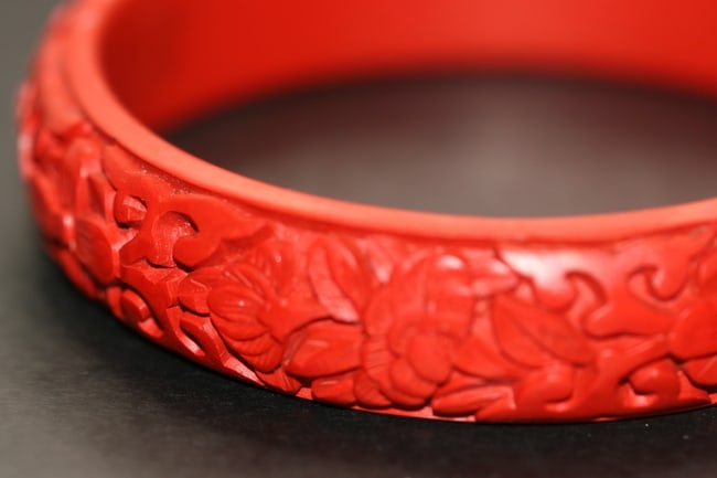 Cinnabar Carved Vintage Bracelet Magnificent Lot 566: Cinnabar Carved Vintage Bracelet Magnificent measures 5/8" wide and the opeing across is 2 1/2"
