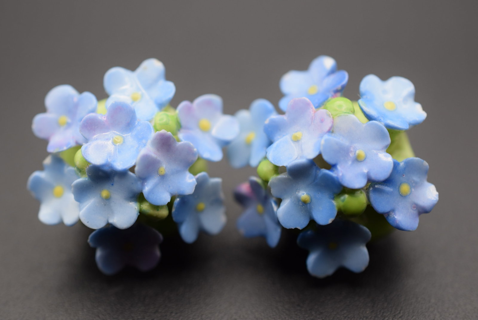 Porcelain Forget me Not Clip Signed Earrings Vintage Lot HK 751: Porcelain Forget me Not Clip Signed Earrings Vintage not perfect has a chip on the tip of one flower