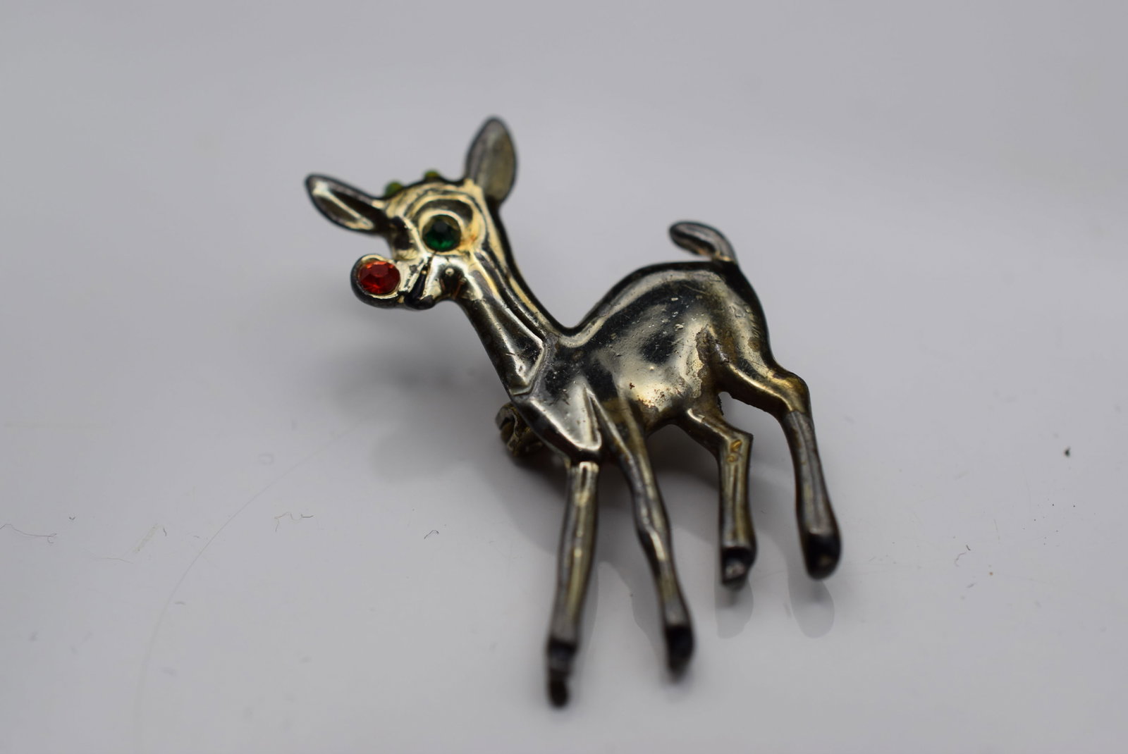 Rudolph Holiday Mini Scatter Reindeer Brooch Pin Vintage 1940's Lot HK 1007: Rudolph Holiday Mini Scatter Reindeer Brooch Pin Vintage 1940's measures 1 3/8" x 1" with Rhinestone Nose and Eye