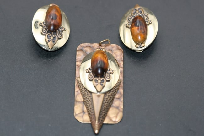Hammered Copper Pendant Earrings Set Amber synth center Lot 1232: Hammered Copper Pendant Earrings Set Amber synthetic centers pendant measures 2 1/4" x 1" matching clip earrings measure 1 1/4" x 7/8"
