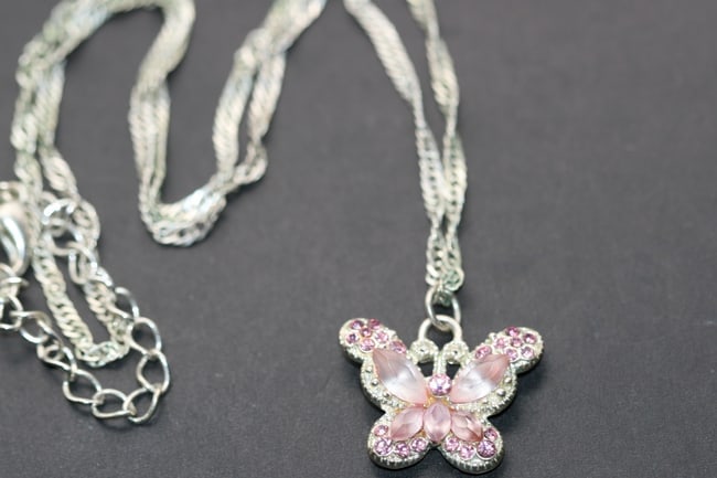 Pink Rose Butterfly Rhinestone Pendant Necklace Lot 1238: Pink Rose Butterfly Rhinestone Pendant Necklace pendant measures 7/8" x 3/4" and the chain measures 18" long