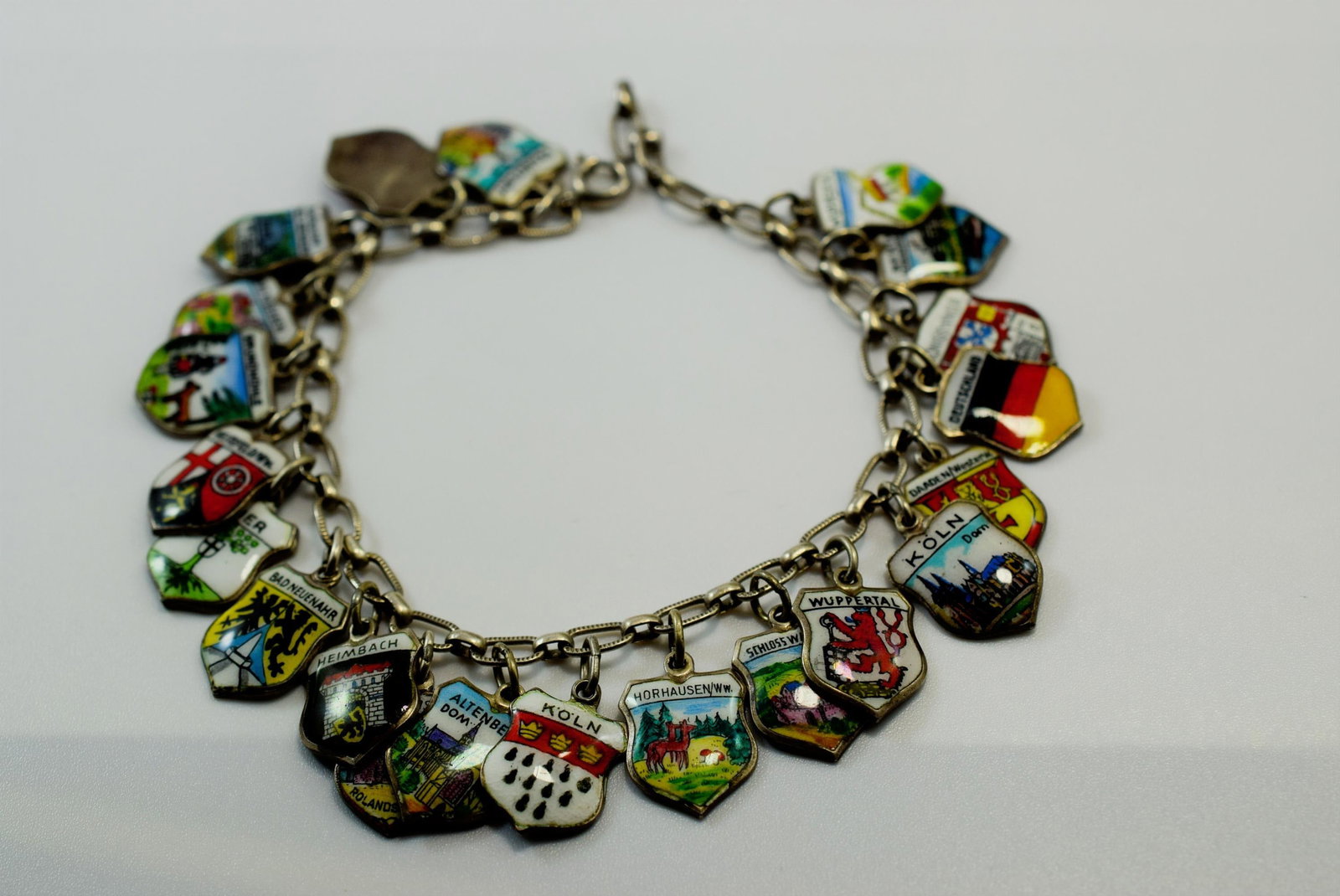 21 Charm Enamel Deutschland all Enamel Cities Sterling 1950's Charm Bracelet Lot IL 251: 21 Charm Enamel Deutschland all Enamel Cities Sterling 1950's Charm Bracelet measures 7 1/2" long each one signed 800 weighs 25 Grams