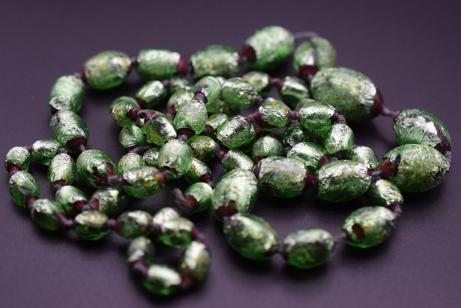 Purple Green Foiled Glass Vintage knotted Necklace 33" Lot#CF 365: Purple Green Foiled Glass Vintage knotted Necklace 33" long glass beads measure 18mm to 8mm