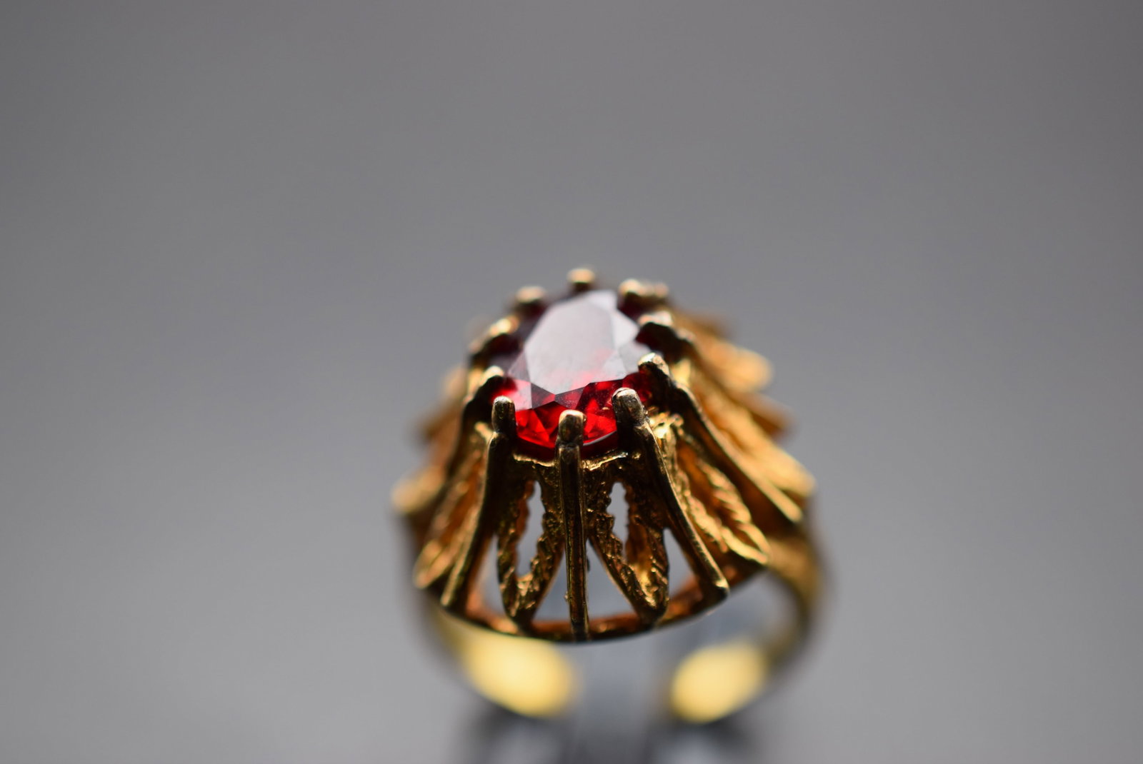 1970's Cocktail Ring Size 5.5 Red Rhinestone Lot 548: 1970's Cocktail Ring Size 5.5 Red Rhinestone Center stone top measures 3/4" across the top