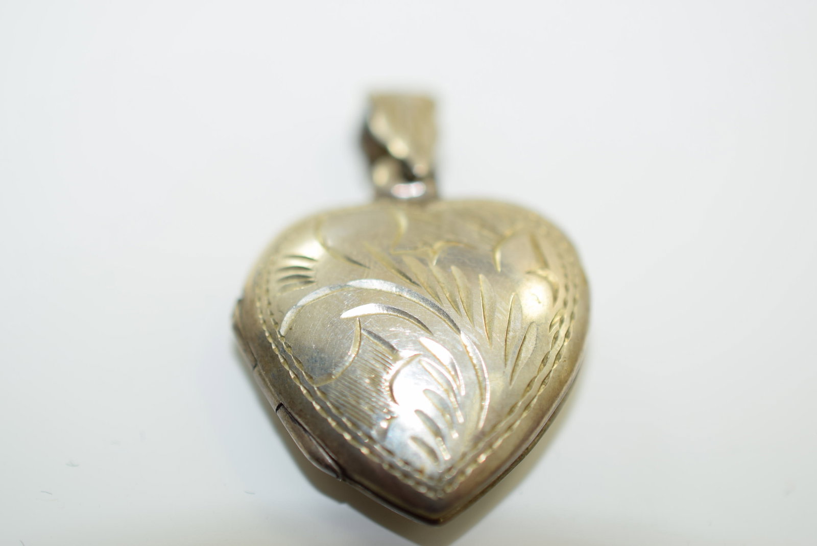 Locket 925 Sterling Pendant Vintage Lot IL 617: Locket 925 Sterling Pendant Vintage with photos 1" plus bale Signed 925 inside the bale is nicely etched all on both sides