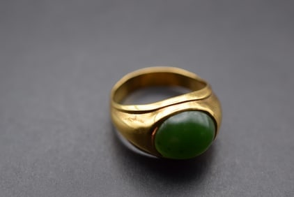 Uncas Gold Karat Clad Process Jade Ring Size 12.5 Lot 661: Uncas Gold Karat Clad Process Jade Ring Size 12.5 Signed inside and the top measures 5/8" wide