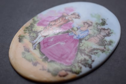Japan Vintage Figural Porcelain Oval Plaque Lot 801: Japan Vintage Figural Porcelain Oval Plaque Measures 3" x 2 1/4"