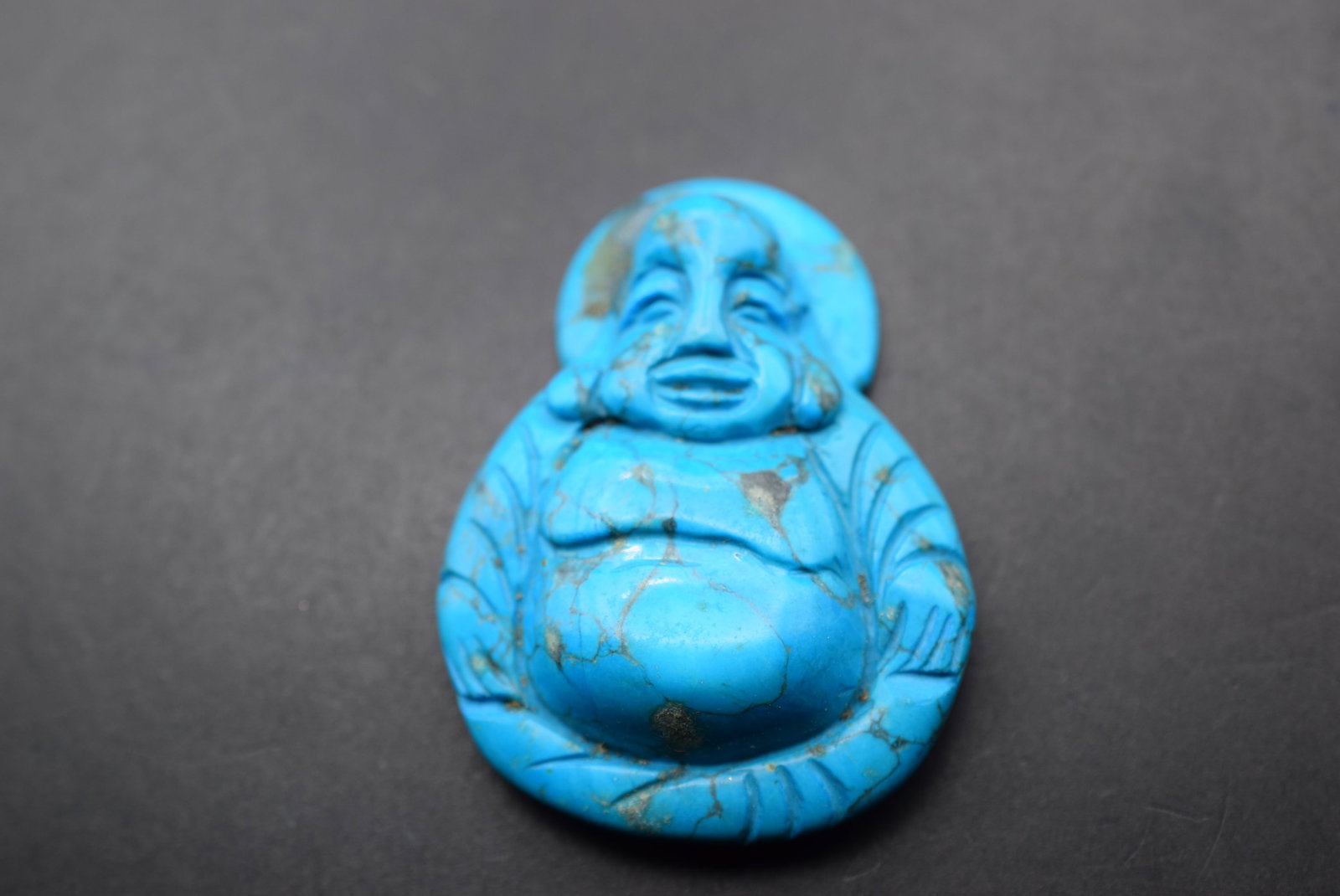 Turquoise Buddha Pendant Lot 843: Turquoise Buddha Pendant measures 2 1/4" x 1 5/8"