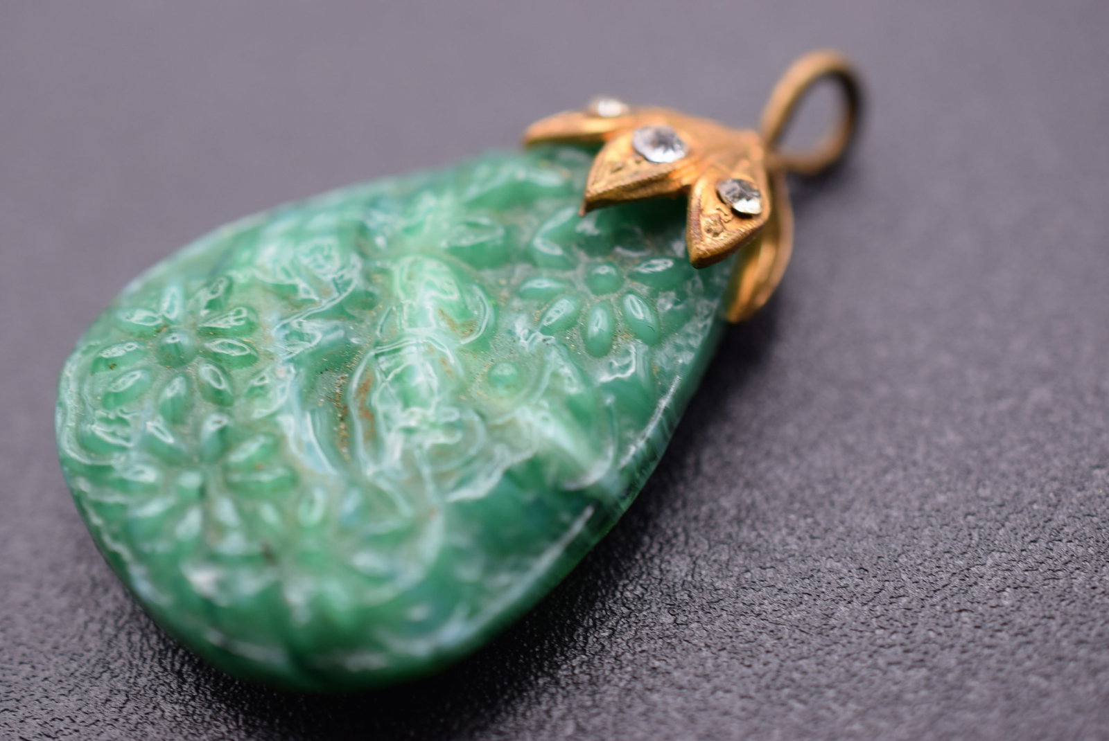 Pressed Glass Green Molded Pendant Lot 962: Pressed Glass Green Molded Pendant measures 1 3/8" x 1"