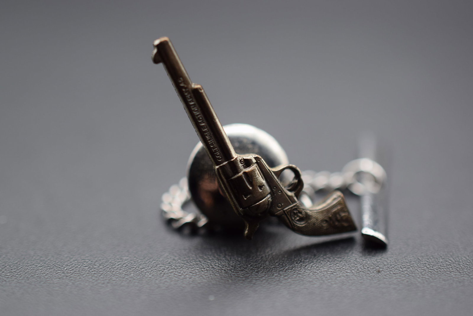 Colt Single Action Army .45 Tie Tack Brooch Pin Vintage Lot# DG 66: Colt Single Action Army .45 Tie Tack Brooch Pin Vintage measures 1" x 3/8" signed down the barrel Colt Single Action Army .45