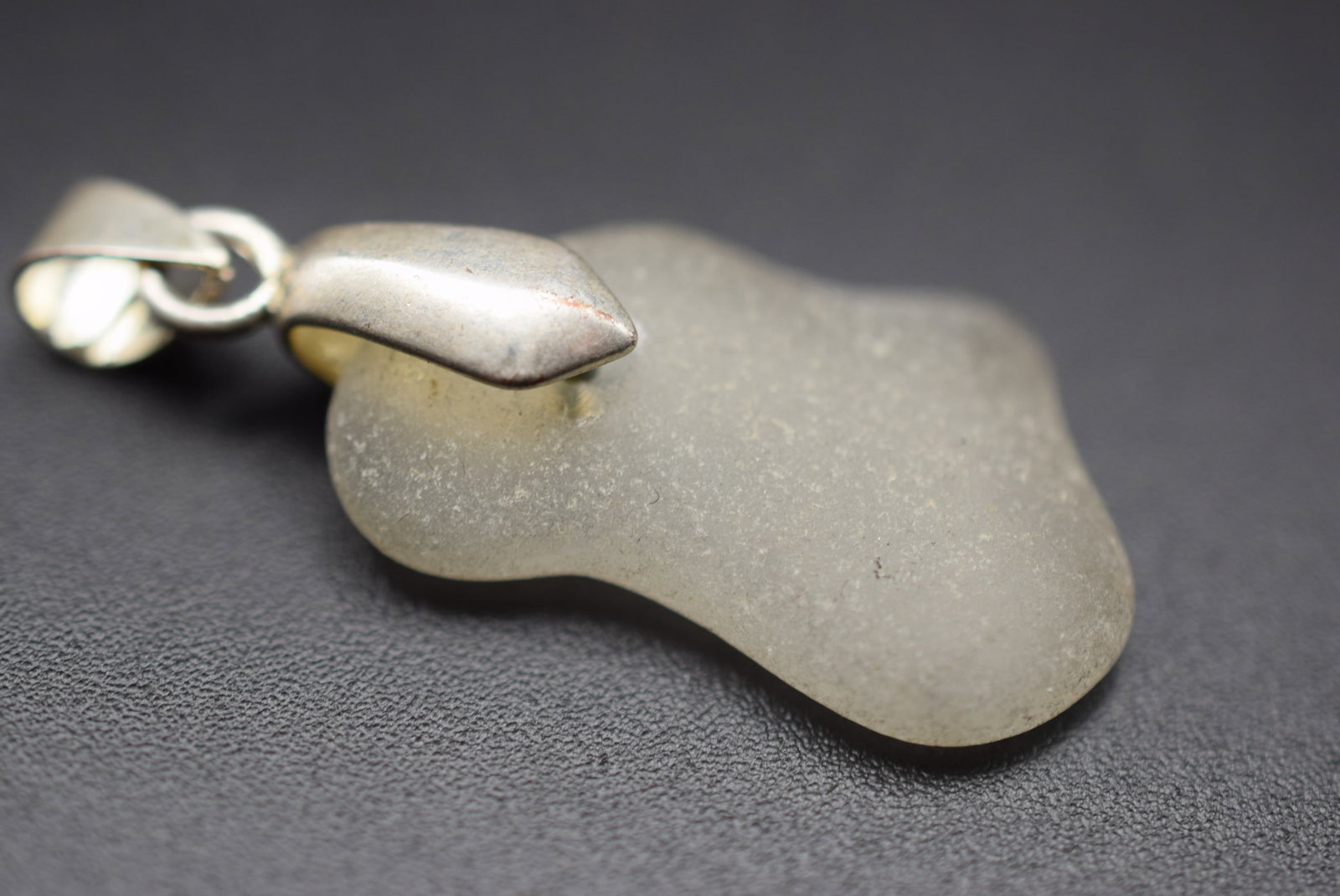 Frosted Glass Pendant Lot 112: Frosted Glass Pendant measures 1 3/8" x 3/4"