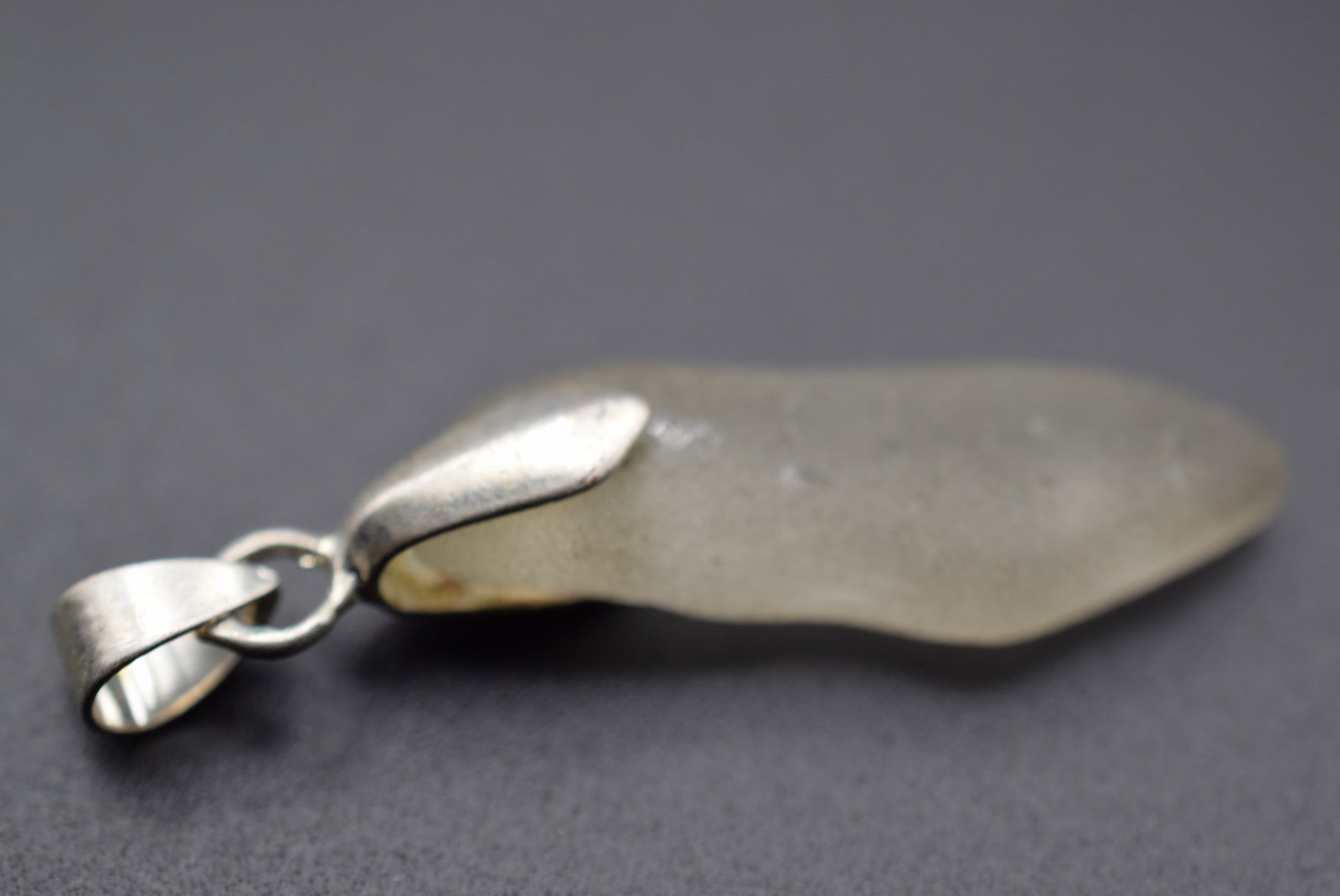 Frosted Glass Pendant Lot 116: Frosted Glass Pendant measures 1 3/4" x 1/2"