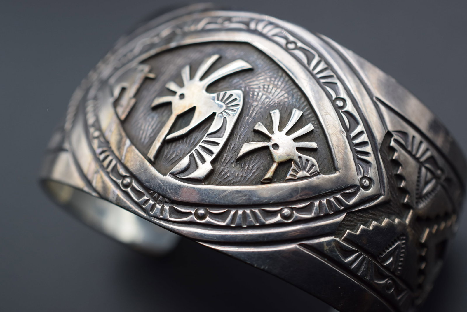 Charlie Bowie Kokopelli Hopi Sterling Silver 925 Bracelet weighs 65.61 grams Lot# DG 220: Charlie Bowie Kokopelli Hopi Sterling Silver 925 Bracelet weighs 65.61 grams measures 1 5/8" wide and the opening is 2 5/8" across