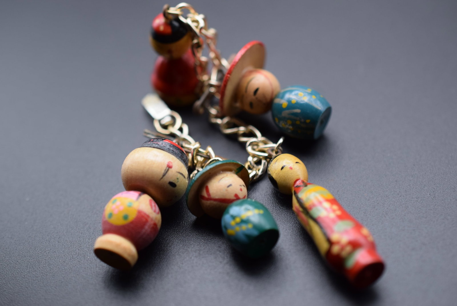 Wooden Charm Chinese Persons Charm Bracelet 1970's Vintage Lot 625: Wooden Charm Chinese Persons Charm Bracelet 1970's Vintage measures 6 1/2" long charms are from 1" to 1 1/2" tall