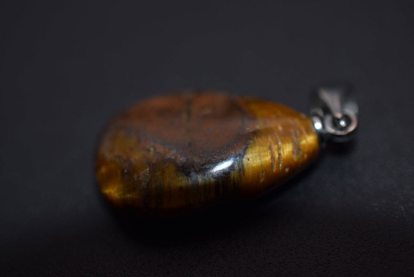 Tiger Eye Pendant Lot 1134: Tiger Eye Pendant measures 7/8" x 5/8"