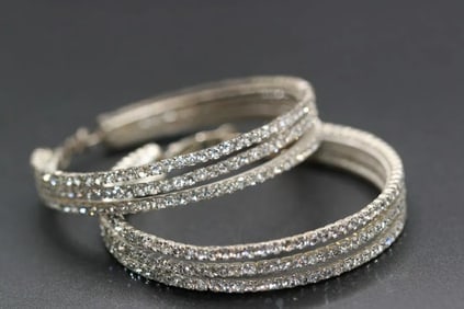 Gigantic Rhinestone Pierced Earrings Hoops 2 1/2" diameter .lot#326: Gigantic Rhinestone Pierced Earrings Hoops 2 1/2" diameter earrings are well made and have a spring action to the backing closure very well made stunning